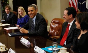 U.S. President Obama looks up during a meeting with executives from leading tech companies at the White House in Washington