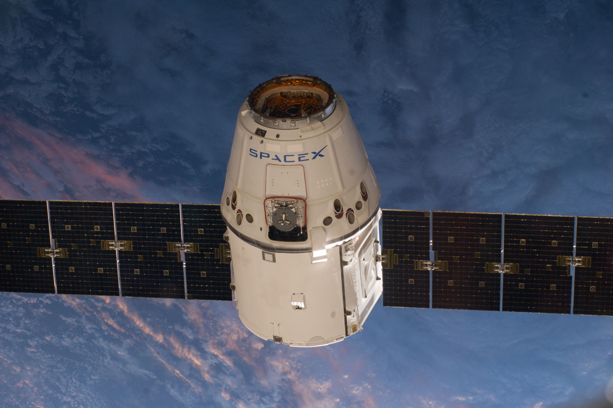 A photo of the arrival of the SpaceX Dragon (V1) at the International Space Station, photographed by the Expedition 39 crew members. The spacecraft was captured by the ISS and berthed, following its April 20 arrival.