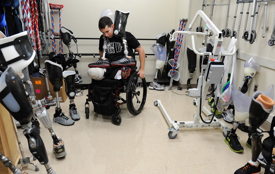 Army Staff Sgt. Sam Shockley, who was injured in Afghanistan when he stepped on a buried bomb, prepares to work on his balance and on walking with prosthetic legs at Walter Reed National Military Medical Center in Bethesda. Matt McClain/The Washington Post