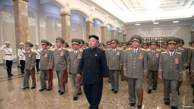 North Korean leader Kim Jong Un (C) visits the Kumsusan Palace of the Sun. KCNA, July 8, 2014.