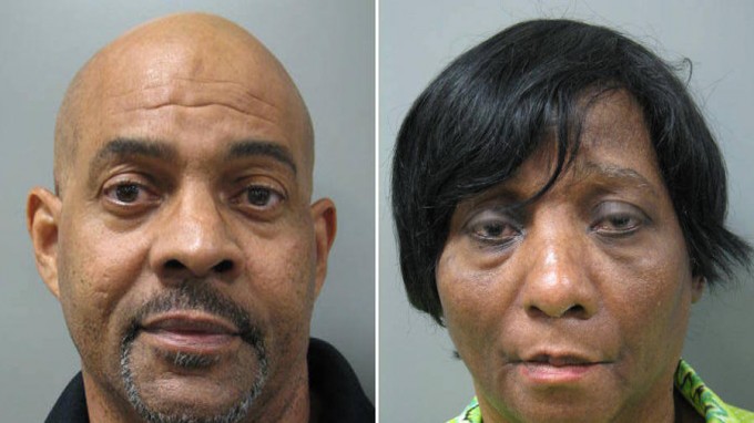 John Land and Janice Land. Booking photos via Montgomery County, MD, police. They are reported to have kept their autistic, twin adult sons locked up at night in their basement, which lacks a bathroom.