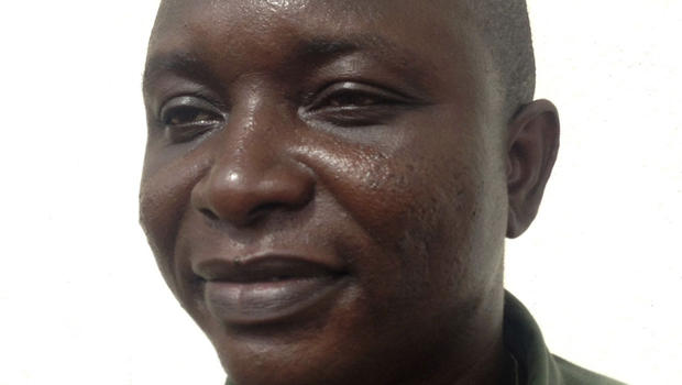 Sheik Umar Khan, head doctor fighting the deadly tropical virus Ebola in Sierra Leone, poses for a picture in Freetown, June 25, 2014.