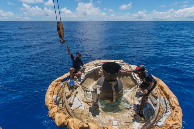 Divers retrieve the test vehicle for NASA's Low-Density Supersonic Decelerator off the coast of the U.S. Navy's Pacific Missile Range Facility in Kauai, Hawaii. Image: NASA/JPL-Caltech