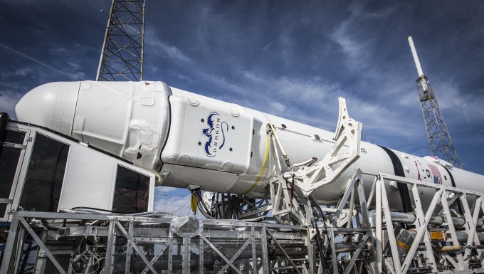 SpaceX's Dragon spacecraft and Falcon 9 rocket are seen in the horizontal position ahead of a planned Jan. 10, 2015 launch from Cape Canaveral Air Force Station in Florida.