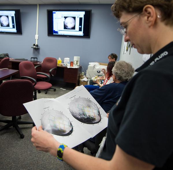 The New Horizons team at work, after a successful Pluto encounter. Photos: NASA